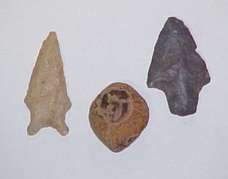 Closeups of the two dart points and odd pebble from Caney Creek